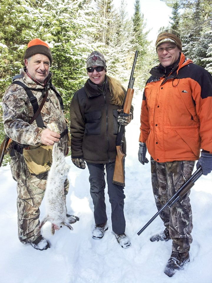 Three hunters bag a snowshoe Hare in the Adirondack Mountains of Upstate NY